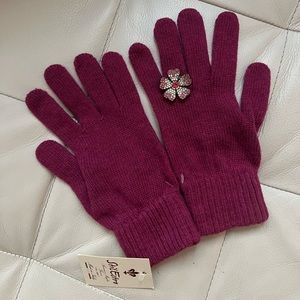 Brand new pink/purple gloves with a flower accent on the ring finger!